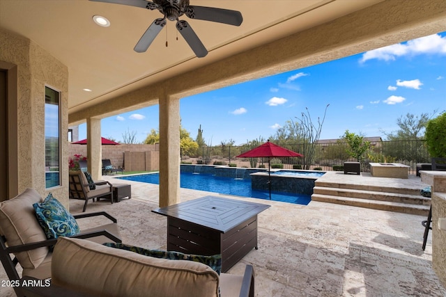 view of pool featuring a fenced in pool, an in ground hot tub, a patio area, and a fenced backyard