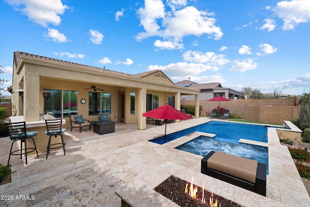 view of pool featuring a ceiling fan, a patio area, a fenced in pool, a bar, and a fenced backyard