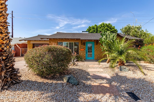 8738 E Vista Dr, Scottsdale, AZ 85250 - ranch-style house with a shingled roof and brick siding