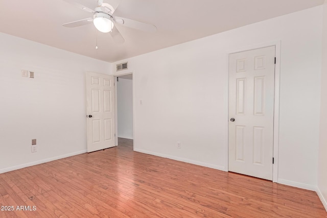 8738 E Vista Dr, Scottsdale, AZ 85250 - empty room featuring light wood-style floors and a ceiling fan