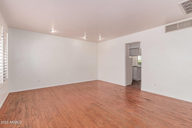 8738 E Vista Dr, Scottsdale, AZ 85250 - unfurnished room with wood finished floors and baseboards