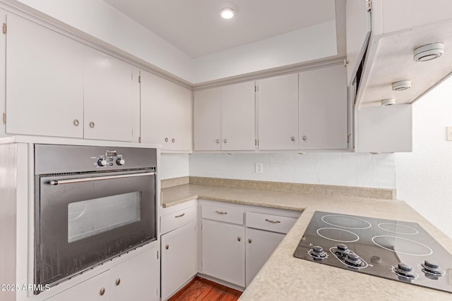 8738 E Vista Dr, Scottsdale, AZ 85250 - kitchen with black appliances, light countertops, and wood finished floors