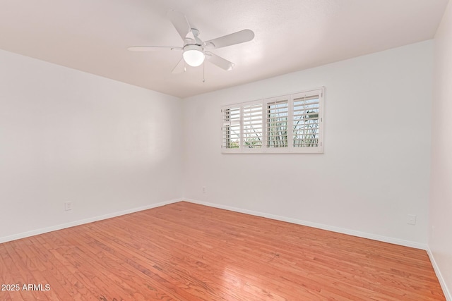 8738 E Vista Dr, Scottsdale, AZ 85250 - empty room with light wood-style flooring and a ceiling fan