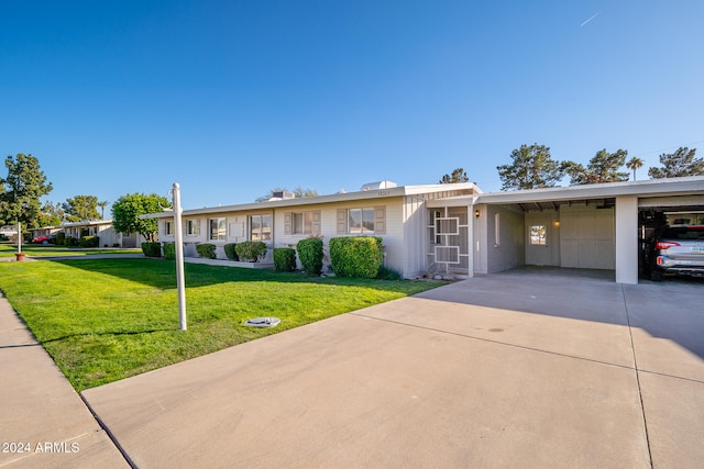 ranch-style house with a carport and a front lawn