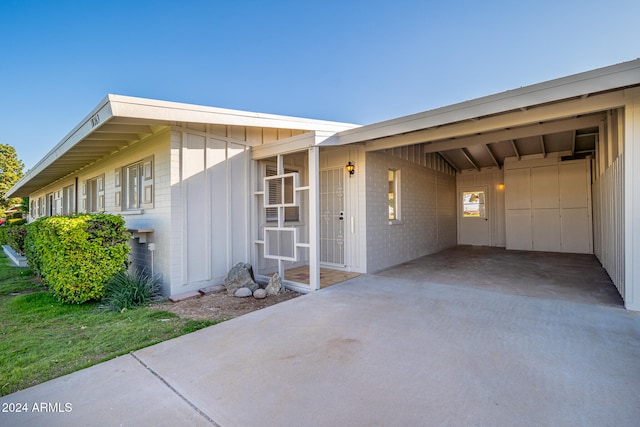 entrance to property featuring a carport