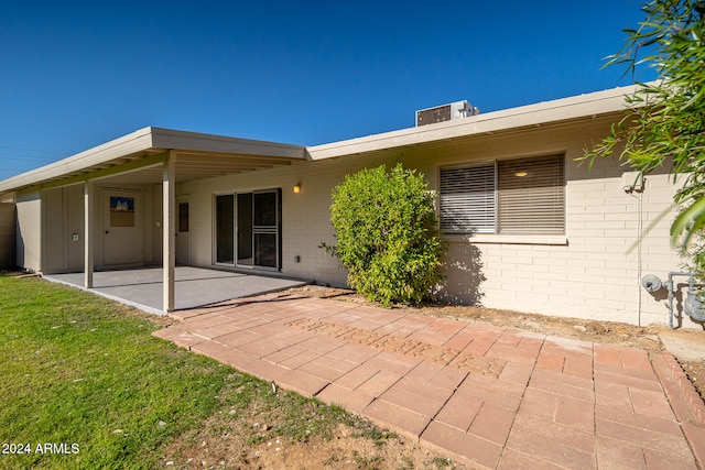 back of property featuring a patio