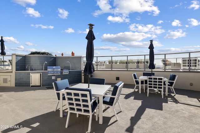 view of patio / terrace featuring sink, a grill, and area for grilling