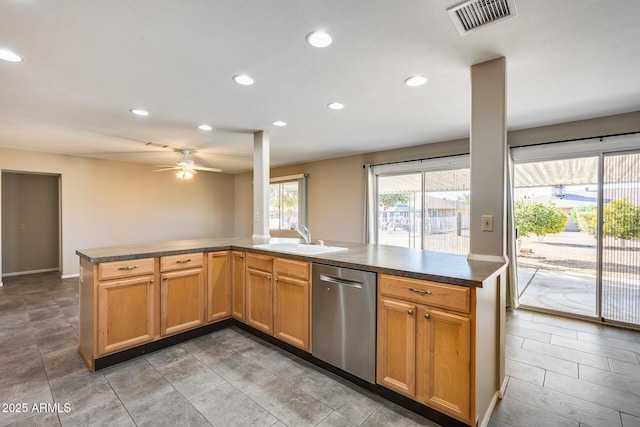 kitchen with sink, stainless steel dishwasher, ceiling fan, and kitchen peninsula