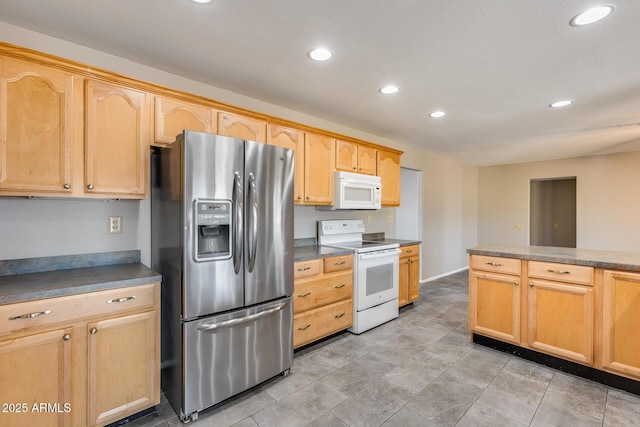 kitchen featuring white appliances and light brown cabinets