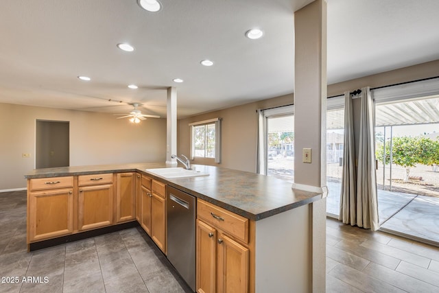 kitchen featuring dishwasher, sink, ceiling fan, and kitchen peninsula