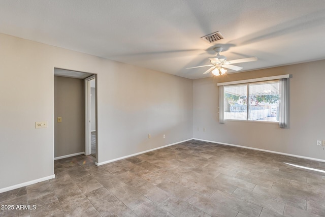 unfurnished room with ceiling fan