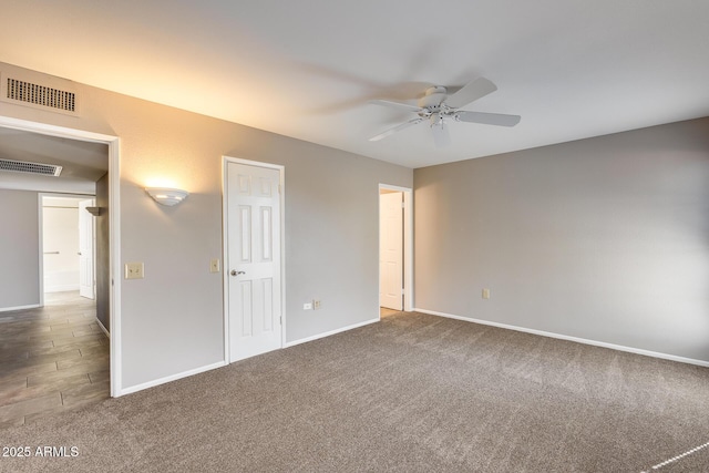 unfurnished bedroom with ceiling fan and dark colored carpet