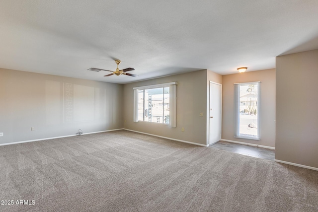 interior space featuring ceiling fan, plenty of natural light, and light carpet