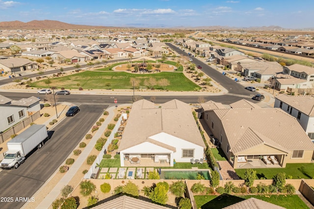 drone / aerial view featuring a residential view and a mountain view