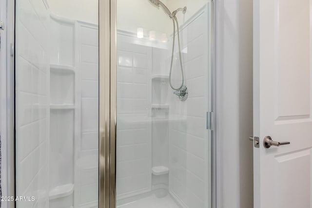 bathroom with a shower stall