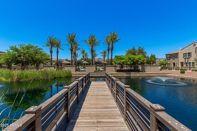 dock area featuring a gazebo and a water view