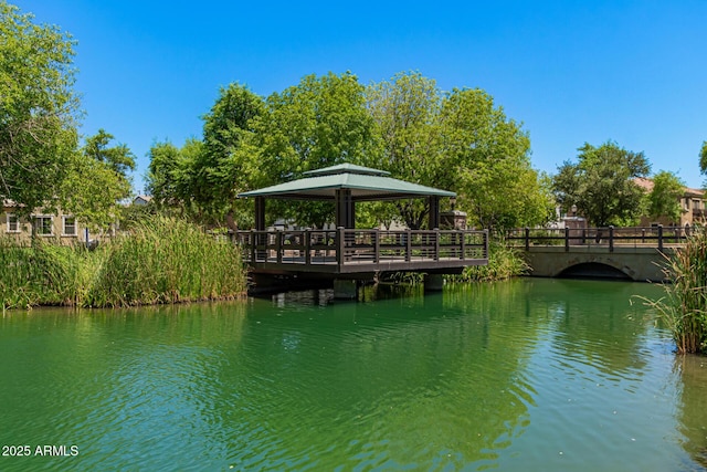 dock area with a gazebo and a water view
