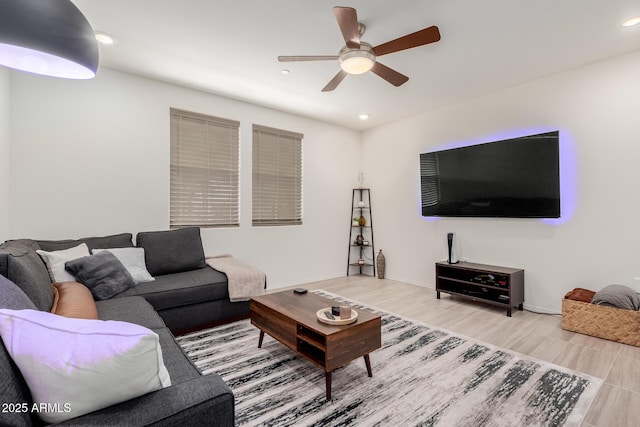 living room featuring a ceiling fan, wood finished floors, recessed lighting, and baseboards