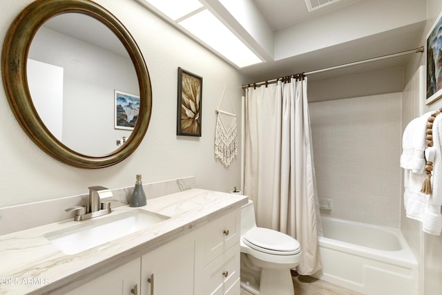 full bath featuring shower / tub combo, toilet, and vanity