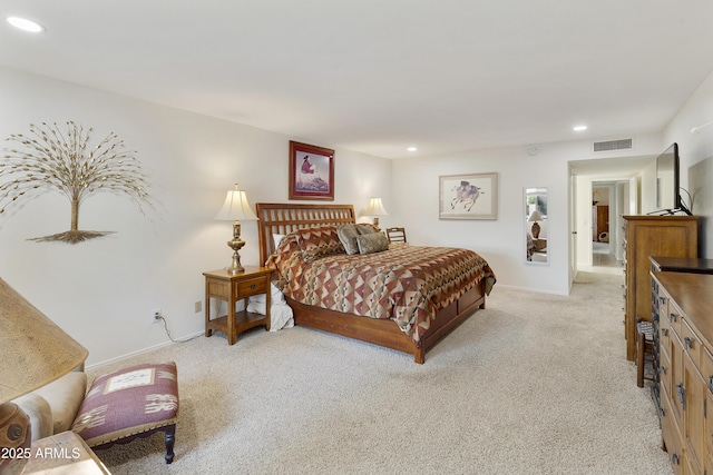 bedroom with light colored carpet, visible vents, baseboards, and recessed lighting