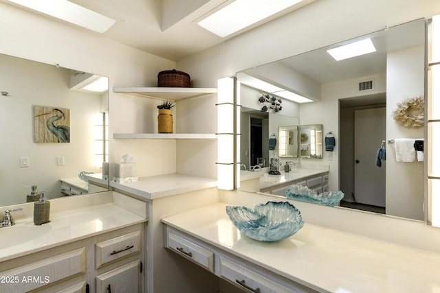 bathroom featuring visible vents and vanity