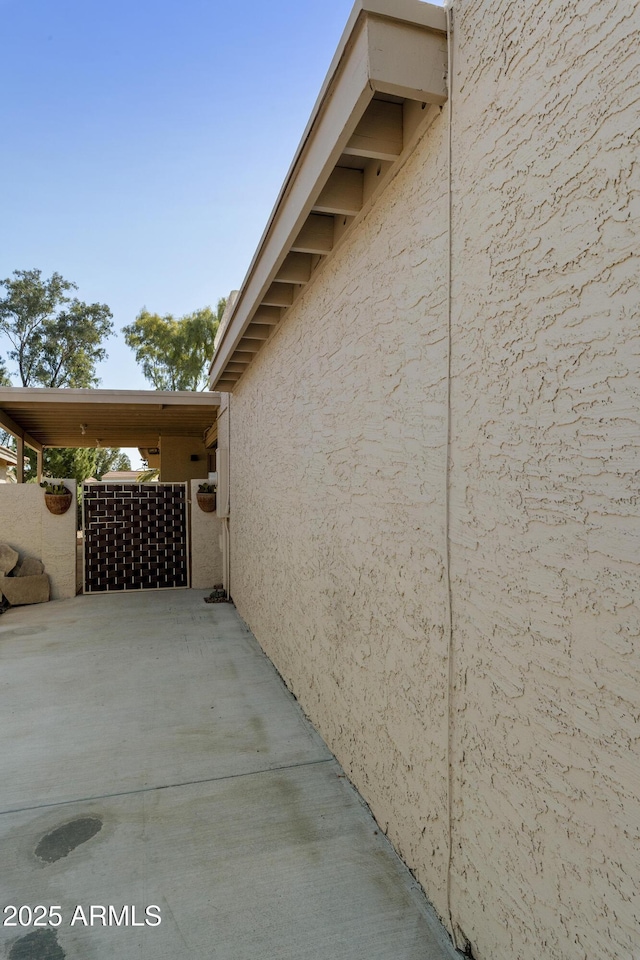 view of side of home featuring stucco siding