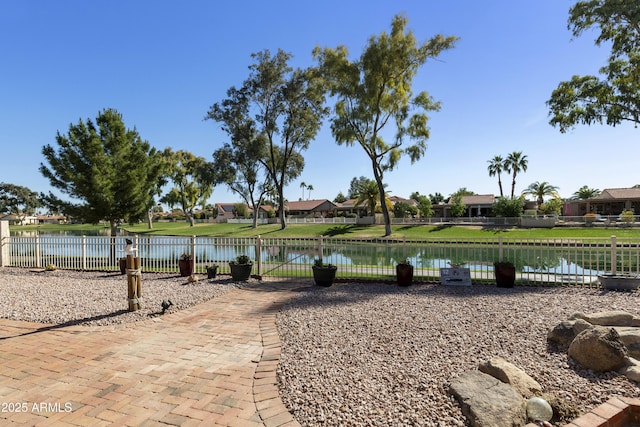 property view of water featuring fence