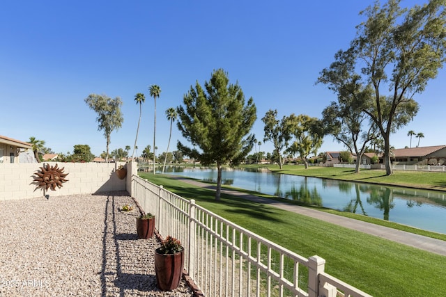 property view of water featuring fence