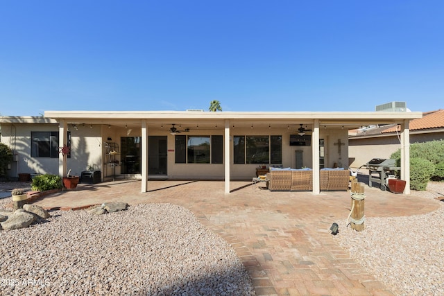 rear view of house with an outdoor living space, ceiling fan, cooling unit, and a patio
