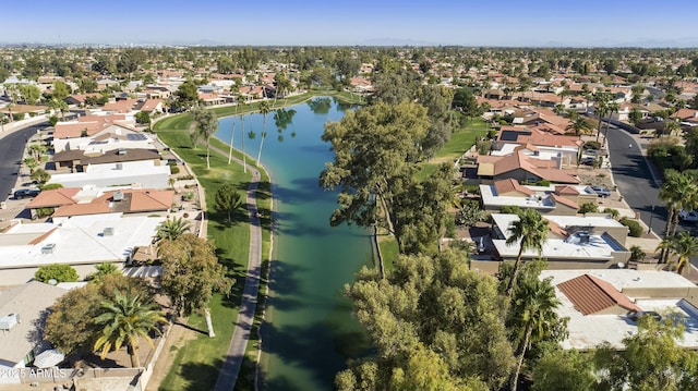 drone / aerial view featuring a water view and a residential view