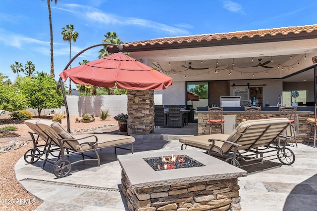 7510 E Larkspur Dr, Scottsdale, AZ 85260 - view of patio / terrace featuring a fire pit and a ceiling fan