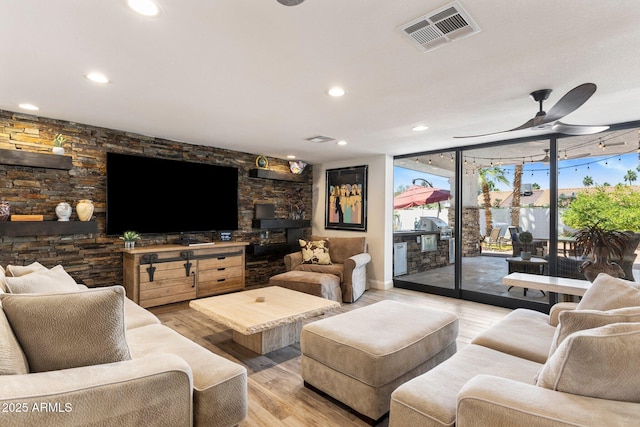 7510 E Larkspur Dr, Scottsdale, AZ 85260 - living room with a wall of windows, light wood-style flooring, ceiling fan, and recessed lighting