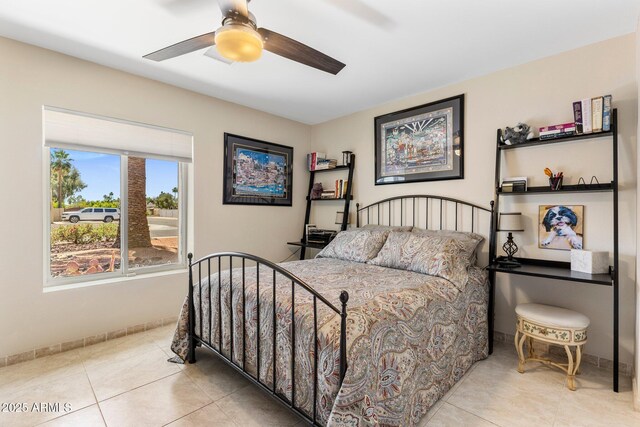 7510 E Larkspur Dr, Scottsdale, AZ 85260 - tiled bedroom with ceiling fan and baseboards