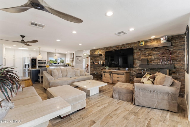 7510 E Larkspur Dr, Scottsdale, AZ 85260 - living room with ceiling fan, light wood finished floors, and recessed lighting