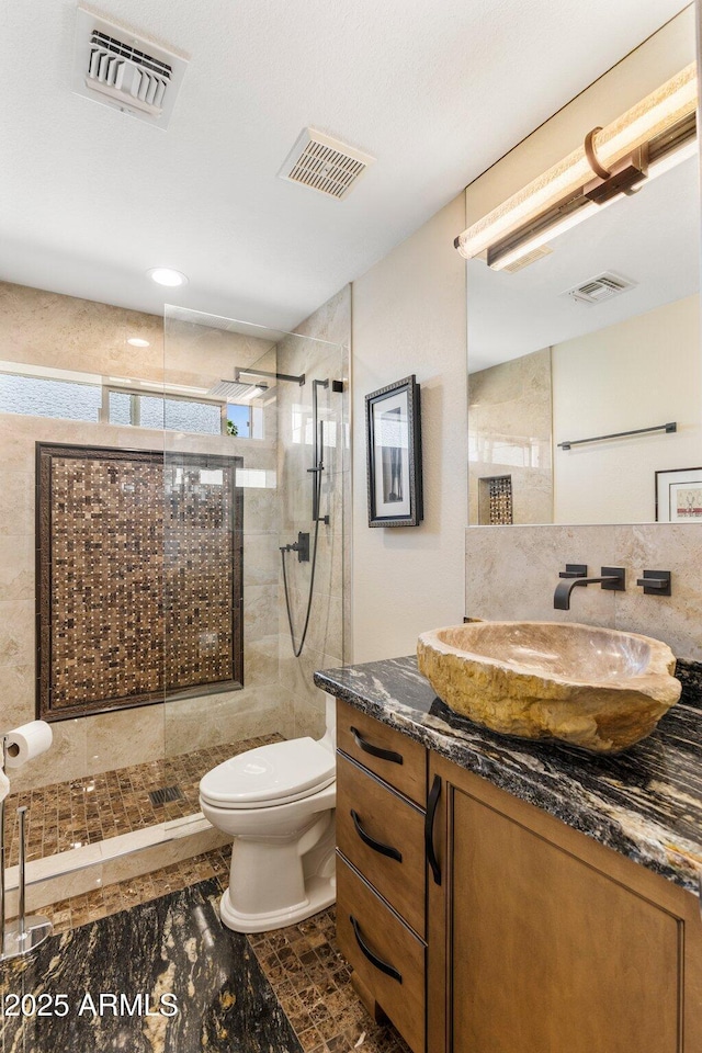 7510 E Larkspur Dr, Scottsdale, AZ 85260 - full bathroom featuring vanity, toilet, and a stall shower