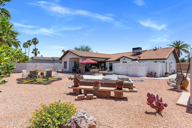 7510 E Larkspur Dr, Scottsdale, AZ 85260 - rear view of house featuring stucco siding, a patio area, a tiled roof, and a fenced backyard