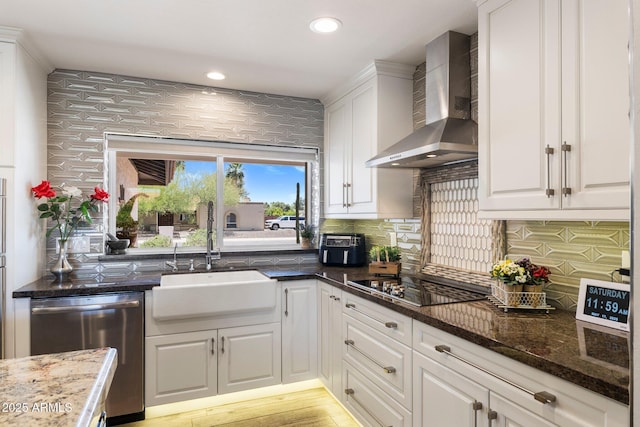 7510 E Larkspur Dr, Scottsdale, AZ 85260 - kitchen with wall chimney exhaust hood, dishwasher, a sink, black electric stovetop, and white cabinetry