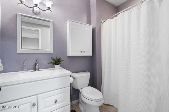 bathroom featuring a shower with curtain, tile patterned flooring, vanity, and toilet