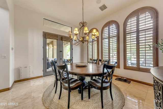3217 N Piedra Cir, Mesa, AZ 85207 - dining space with a chandelier, baseboards, and light tile patterned floors