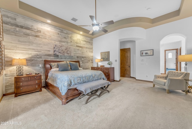 3217 N Piedra Cir, Mesa, AZ 85207 - bedroom featuring arched walkways, an accent wall, carpet floors, wooden walls, and recessed lighting