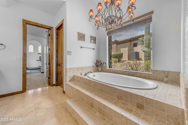 3217 N Piedra Cir, Mesa, AZ 85207 - full bath featuring a bath, healthy amount of natural light, a chandelier, and tile patterned floors