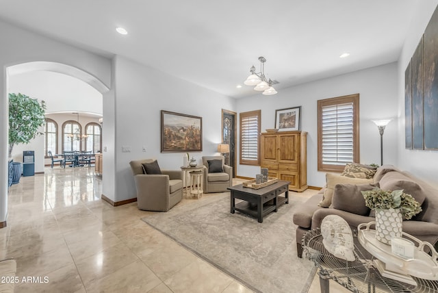 3217 N Piedra Cir, Mesa, AZ 85207 - living room featuring arched walkways, a chandelier, recessed lighting, and baseboards