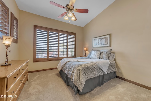 3217 N Piedra Cir, Mesa, AZ 85207 - bedroom with baseboards, light colored carpet, vaulted ceiling, and a ceiling fan