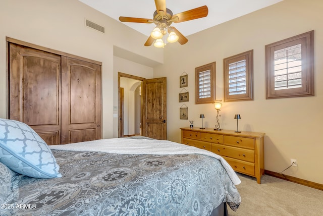 3217 N Piedra Cir, Mesa, AZ 85207 - bedroom with light colored carpet, a closet, baseboards, and ceiling fan