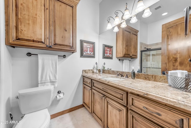 3217 N Piedra Cir, Mesa, AZ 85207 - bathroom with tile patterned flooring, toilet, a shower stall, vanity, and baseboards