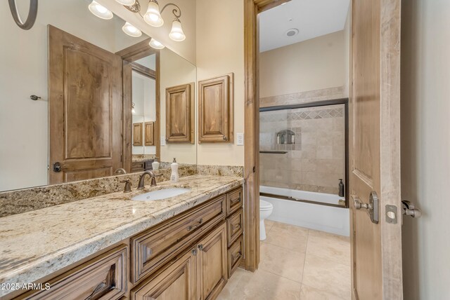 3217 N Piedra Cir, Mesa, AZ 85207 - bathroom with toilet, vanity, combined bath / shower with glass door, and tile patterned floors