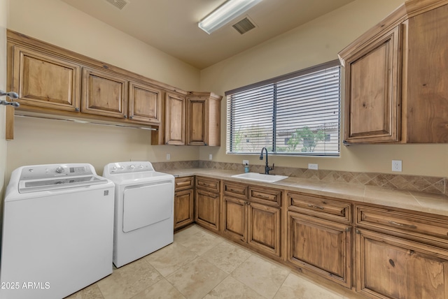 3217 N Piedra Cir, Mesa, AZ 85207 - laundry area with washing machine and dryer, cabinet space, and light tile patterned floors