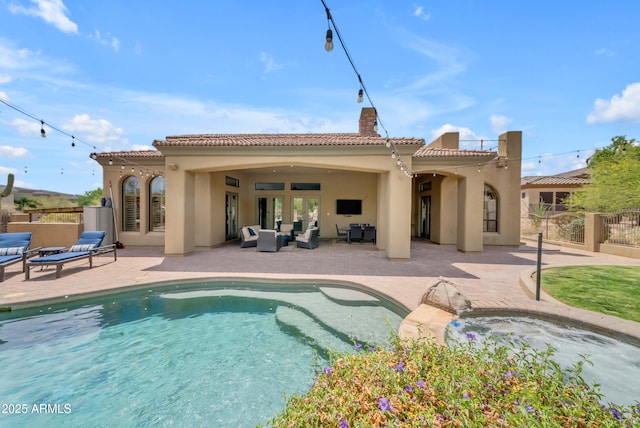 3217 N Piedra Cir, Mesa, AZ 85207 - back of property with an outdoor hangout area, stucco siding, a tile roof, and fence