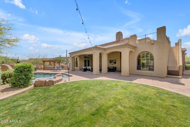3217 N Piedra Cir, Mesa, AZ 85207 - back of house featuring stucco siding, an outdoor pool, a patio, an in-ground hot tub, and a chimney