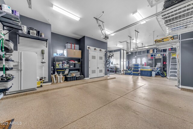 3217 N Piedra Cir, Mesa, AZ 85207 - garage with a garage door opener and freestanding refrigerator